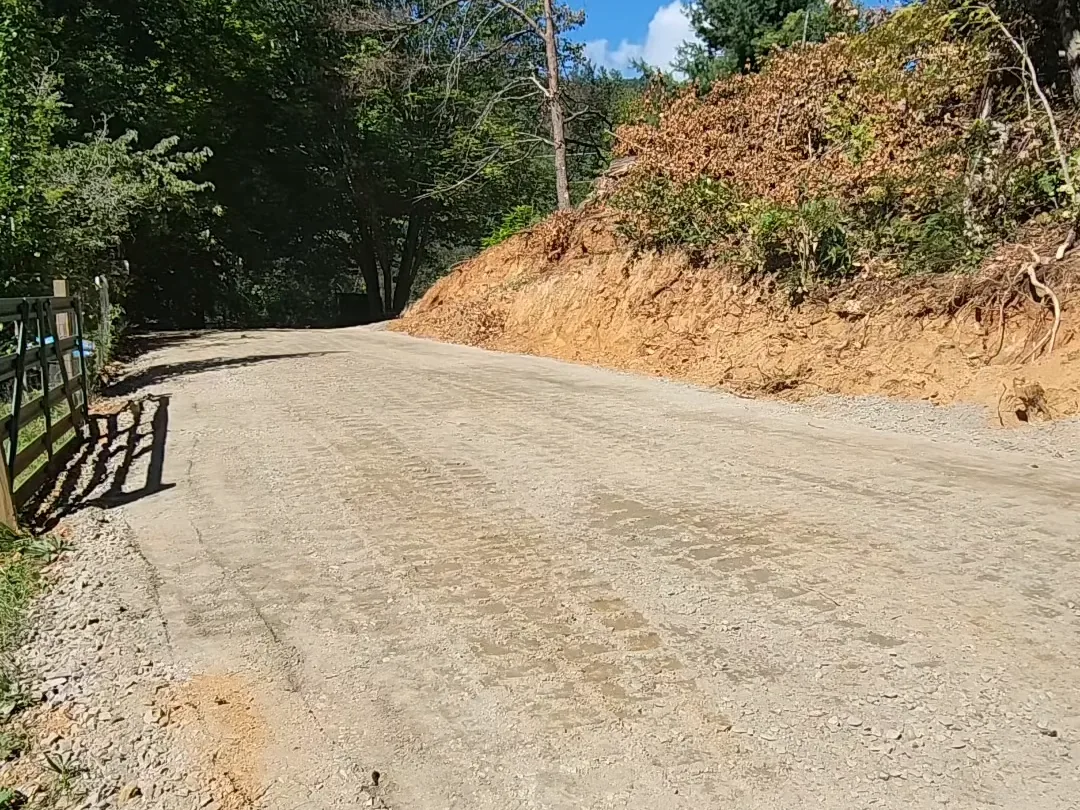A finished gravel driveway on a mountain grade, from our own footage
